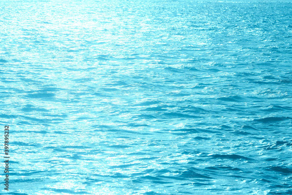 Blue sunlight reflecting in glittering sea. sparkling in water - obrazy, fototapety, plakaty 