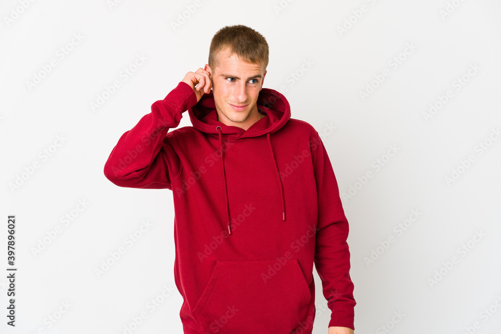 Young caucasian handsome man covering ears with fingers, stressed and desperate by a loudly ambient. Young caucasian handsome man covering ears with fingers, stressed and desperate by a loudly ambient.
