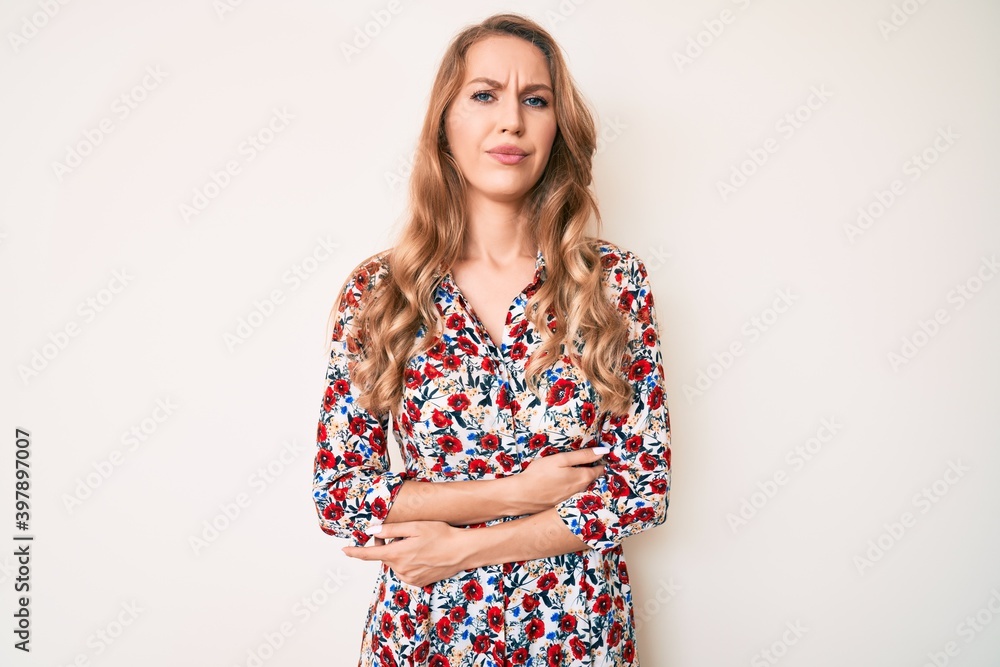 Young caucasian woman with blond hair wearing summer dress with hand on stomach because indigestion, painful illness feeling unwell. ache concept. Young caucasian woman with blond hair wearing summer dress with hand on stomach because indigestion, painful illness feeling unwell. ache concept.