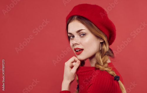 Pretty woman in red cap attractive look red lips cropped look glamor