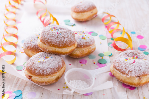 Wallpaper Mural Traditional Berliner for carnival and party. German Krapfen or donuts with streamers and confetti. Colorful carnival or birthday image Torontodigital.ca