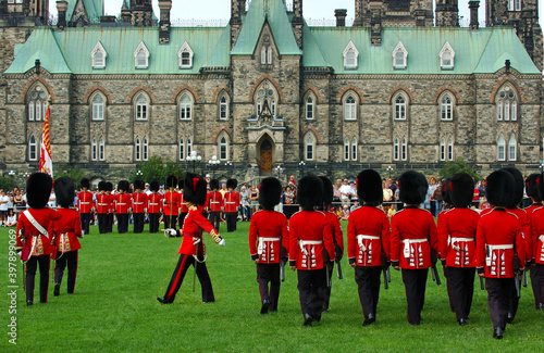 Marching foot guards in Ottawa with West Block Parliament Buidlings photo
