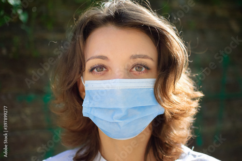 Coronavirus Covid-19 outbreak. Young woman wearing surgical mask on the face for protection from virus during pandemia, quarantine concept