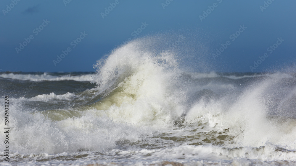 Hurricane rages over Europe, the furious sea shows its powerful and destructive face. Surprising shapes of foamed waves.
