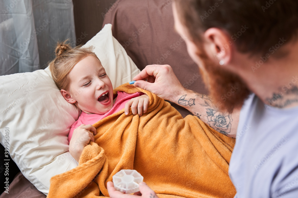 Parent taking care of sick daughter Parent taking care of sick daughter