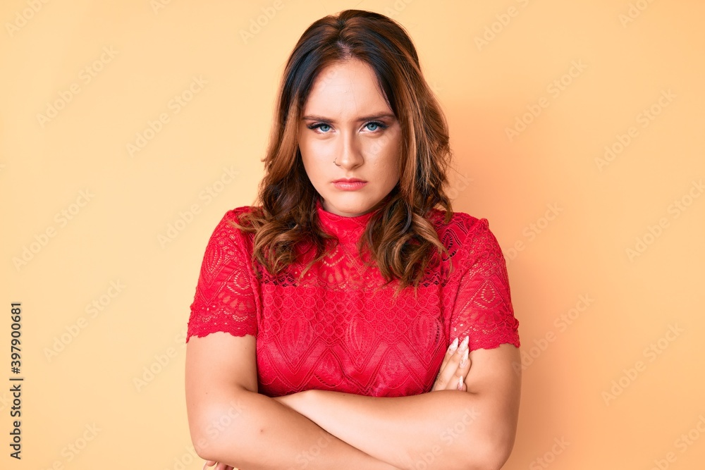 Obraz premium Young beautiful caucasian woman wearing casual clothes skeptic and nervous, disapproving expression on face with crossed arms. negative person.