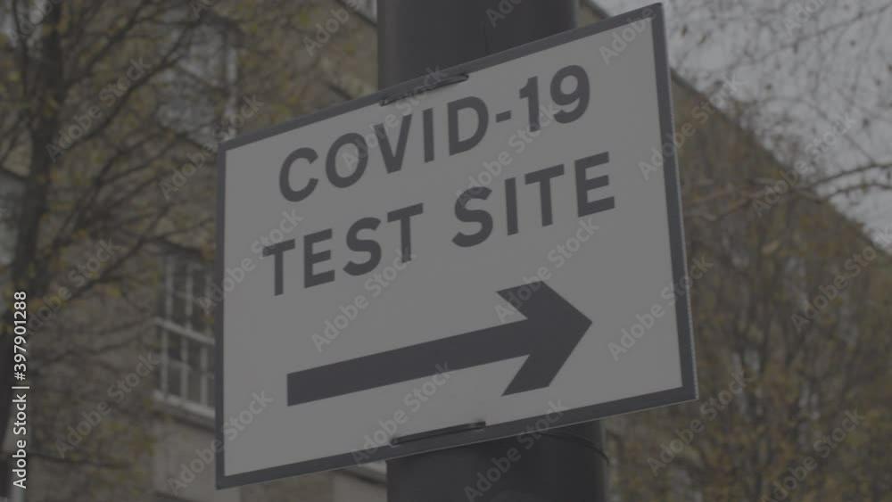 Panned Low show of Covid-19 Test Site Sign