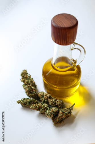 Jar with hemp oil, bud on white background, top view
Medical Cannabis concept
