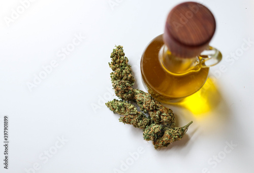 Jar with hemp oil, bud on white background, top view
Medical Cannabis concept