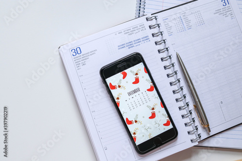 Diary and notebook for Planner. Calendar, smartphone place on white desk. 