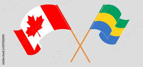 Crossed and waving flags of Canada and Gabon