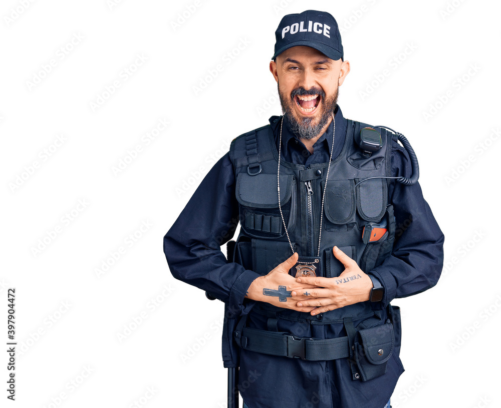 Young handsome man wearing police uniform smiling and laughing hard out loud because funny crazy joke with hands on body. Young handsome man wearing police uniform smiling and laughing hard out loud because funny crazy joke with hands on body.