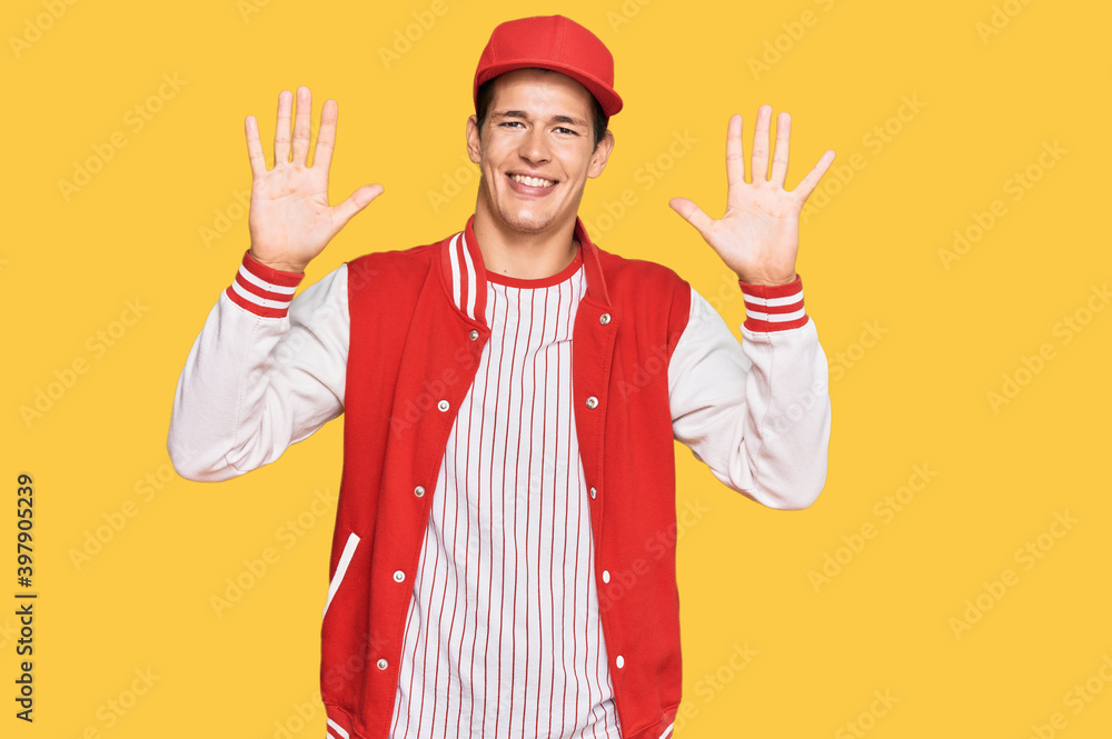 Handsome caucasian man wearing baseball uniform showing and pointing up with fingers number ten while smiling confident and happy. Handsome caucasian man wearing baseball uniform showing and pointing up with fingers number ten while smiling confident and happy.