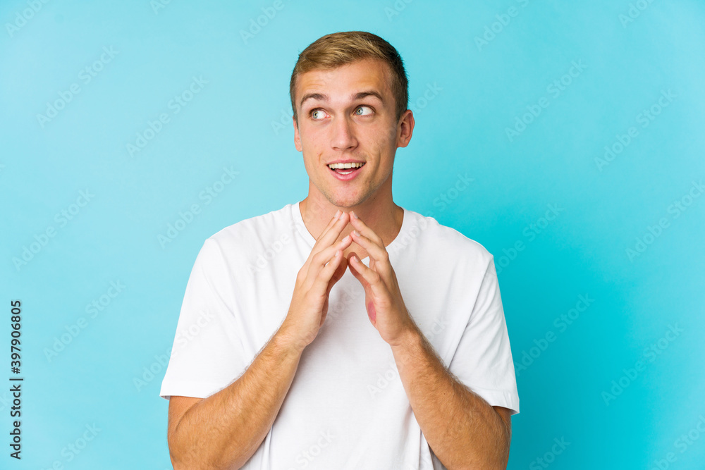 Young caucasian handsome man making up plan in mind, setting up an idea. Young caucasian handsome man making up plan in mind, setting up an idea.