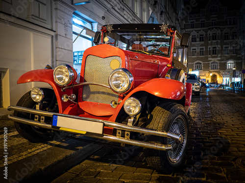 Red old vintage classic car on the night street © bzzup