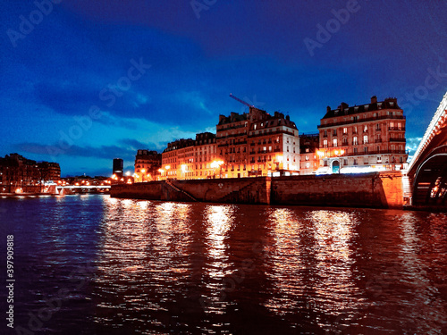 A large body of water with a city in the background