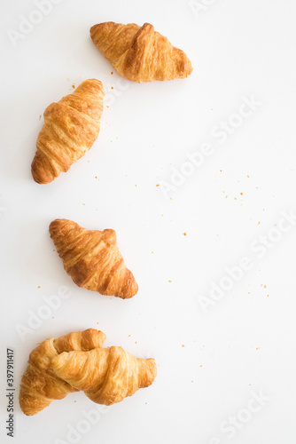 Croissants on white background with empty space.