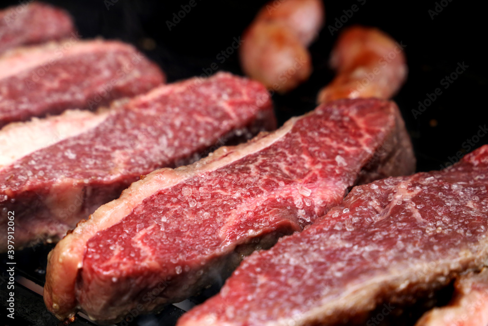 Picanha. Traditional Brazilian meat for barbecue. On wooden background. 