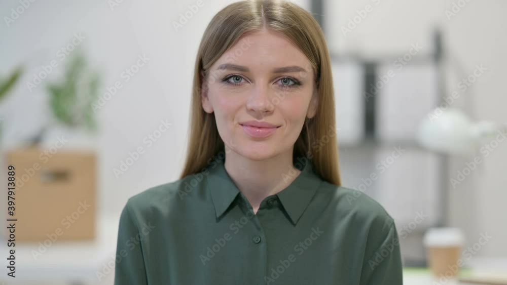 Portrait of Young Woman Shaking Head as Yes Sign Portrait of Young Woman Shaking Head as Yes Sign