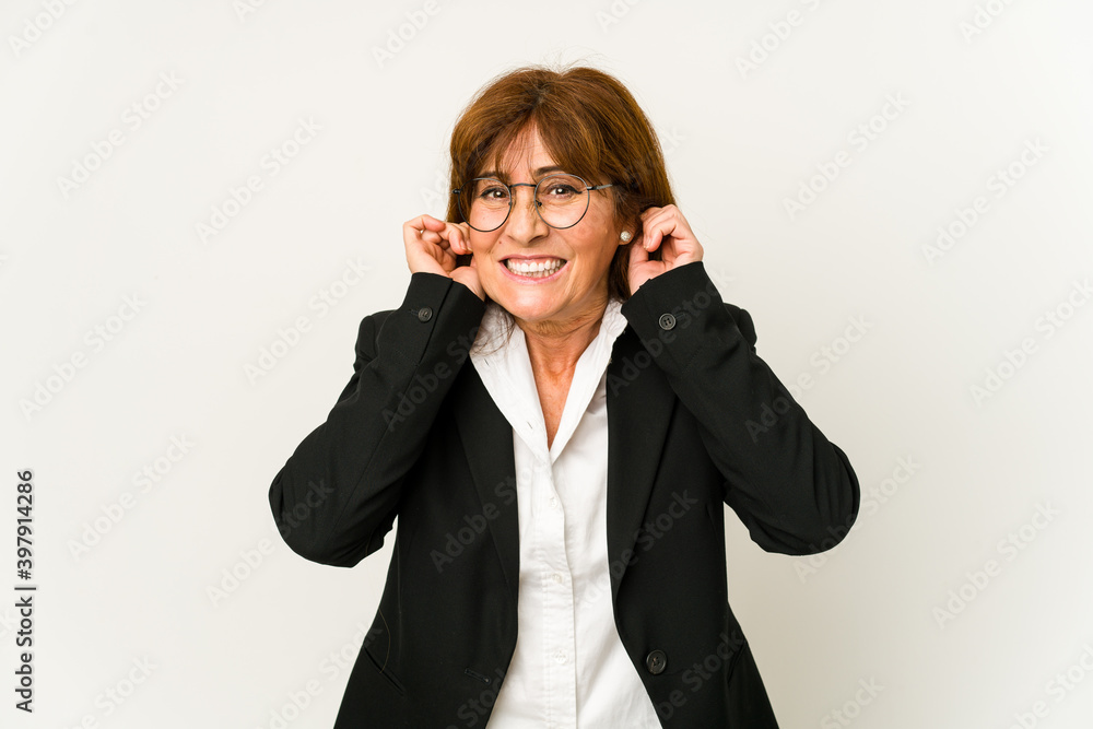 Middle age caucasian business woman isolated covering ears with hands. Middle age caucasian business woman isolated covering ears with hands.