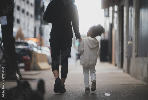 mother and child holding hands