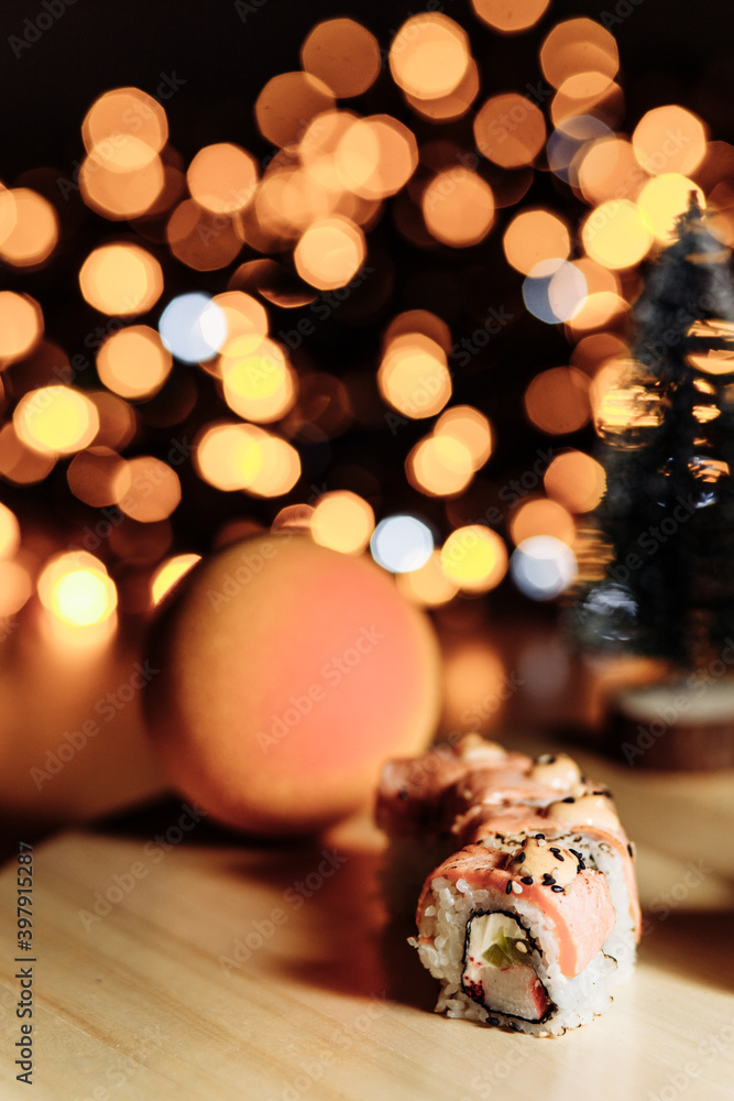 Sushi rolls New Year. Christmas background. Idea for postcard, menu, advertising. Sushi rolls New Year. Christmas background. Idea for postcard, menu, advertising.