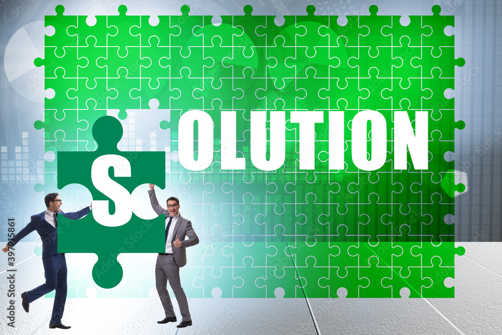 Solution concept with businessman solving jigsaw puzzle Solution concept with businessman solving jigsaw puzzle