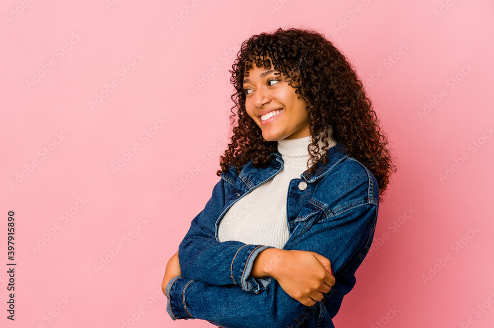 Young african american afro woman isolated laughing and having fun. Young african american afro woman isolated laughing and having fun.