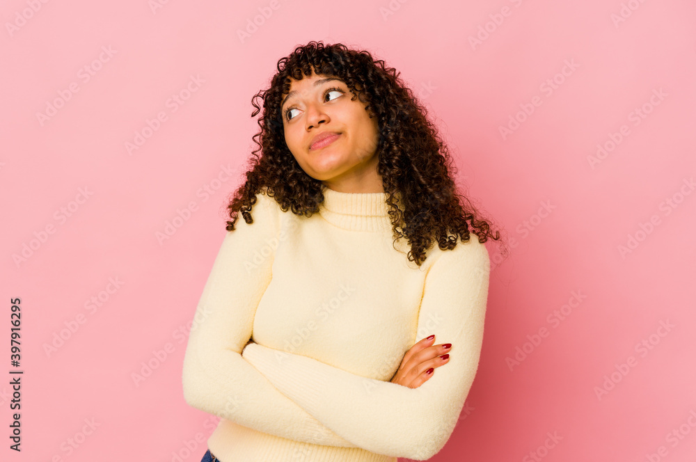 Young african american afro woman isolated dreaming of achieving goals and purposes Young african american afro woman isolated dreaming of achieving goals and purposes