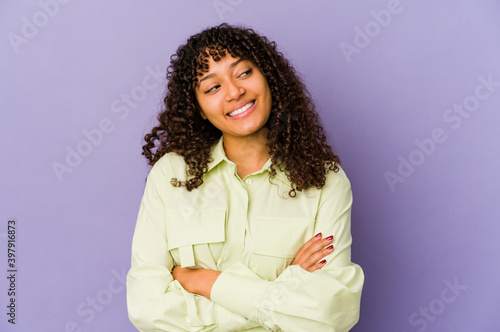 Young african american afro woman isolated smiling confident with crossed arms.