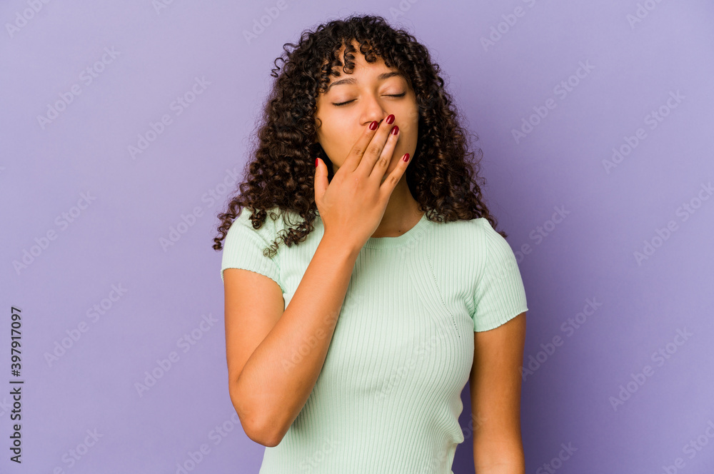 Young african american afro woman isolated yawning showing a tired gesture covering mouth with hand. Young african american afro woman isolated yawning showing a tired gesture covering mouth with hand.