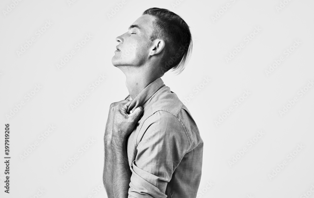 Portrait of a handsome man on a light background close-up cropped view of a black and white photograph model Portrait of a handsome man on a light background close-up cropped view of a black and white photograph model
