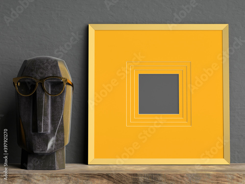 Fototapeta Naklejka Na Ścianę i Meble -  Golden mock up picture frame on dark plaster wall with black marble head sculpture on wooden shelf; square frame type; stylish poster frame mock up background; 3d rendering, 3d illustration