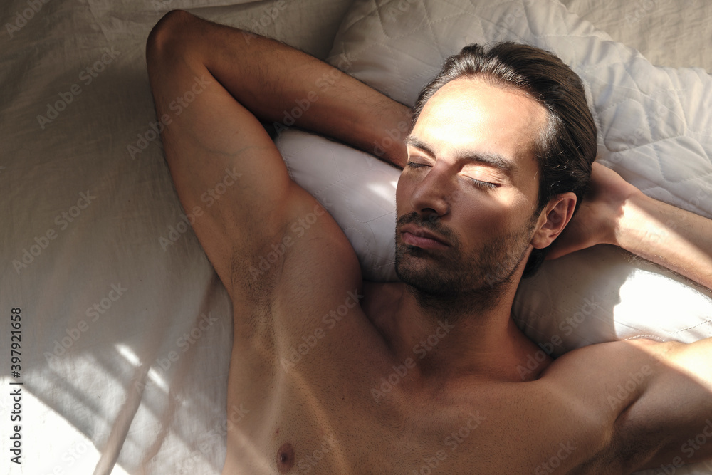 Obraz premium Muscular young man resting in the morning