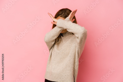 Fototapeta Naklejka Na Ścianę i Meble -  Young skinny caucasian teenager girl keeping two arms crossed, denial concept.