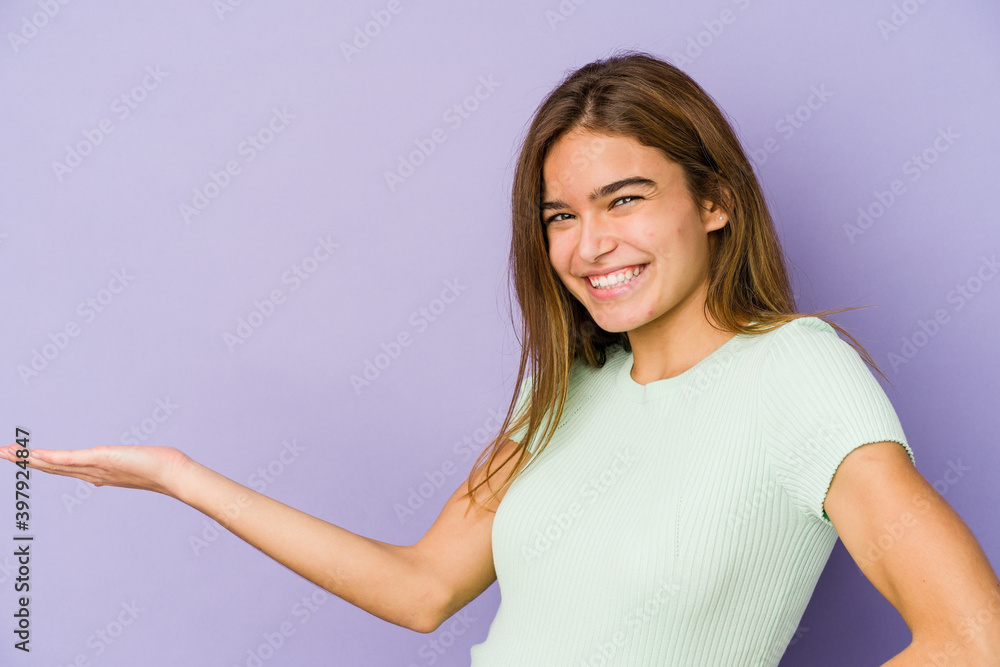 Young skinny caucasian girl teenager on purple background showing a welcome expression. Young skinny caucasian girl teenager on purple background showing a welcome expression.