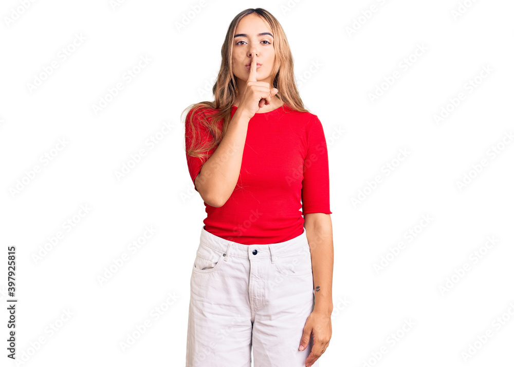 Young beautiful blonde woman wearing casual clothes asking to be quiet with finger on lips. silence and secret concept. Young beautiful blonde woman wearing casual clothes asking to be quiet with finger on lips. silence and secret concept.