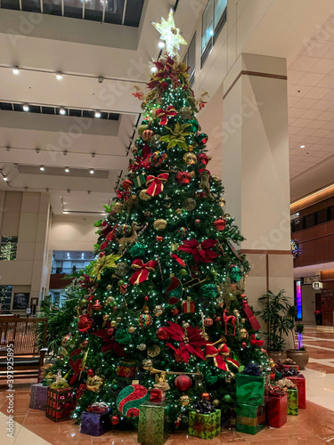 A huge christmas tree in office lobby