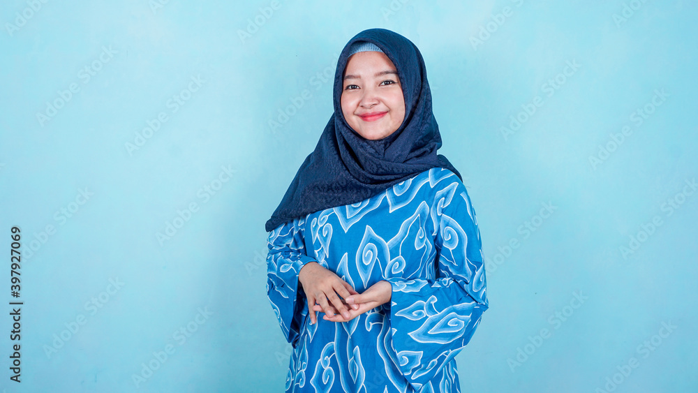 Portrait of a confident businesswoman wearing batik indonesian traditional clothes 