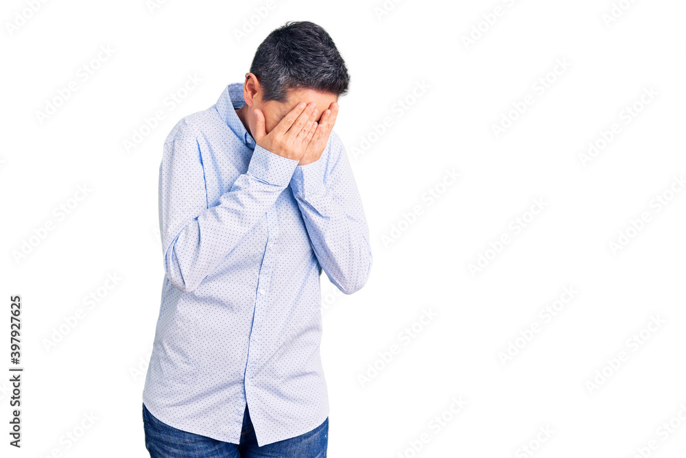 Young woman with short hair wearing business clothes with sad expression covering face with hands while crying. depression concept. Young woman with short hair wearing business clothes with sad expression covering face with hands while crying. depression concept.