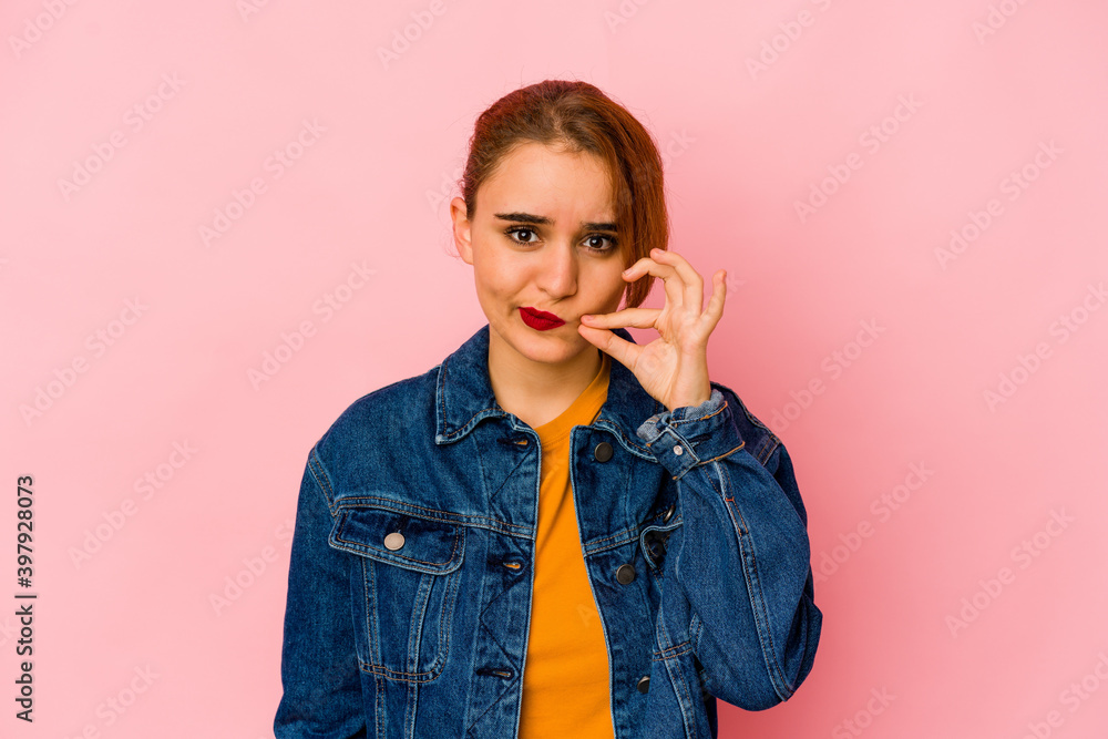 Young arab mixed race woman with fingers on lips keeping a secret. Young arab mixed race woman with fingers on lips keeping a secret.