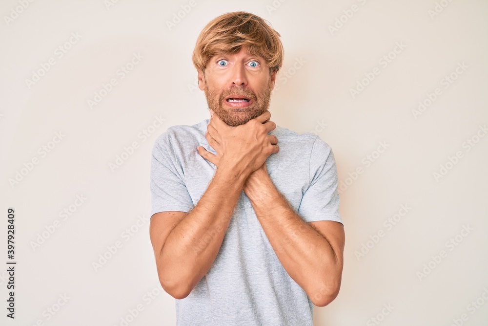 Young blond man wearing casual clothes shouting and suffocate because painful strangle. health problem. asphyxiate and suicide concept. Young blond man wearing casual clothes shouting and suffocate because painful strangle. health problem. asphyxiate and suicide concept.