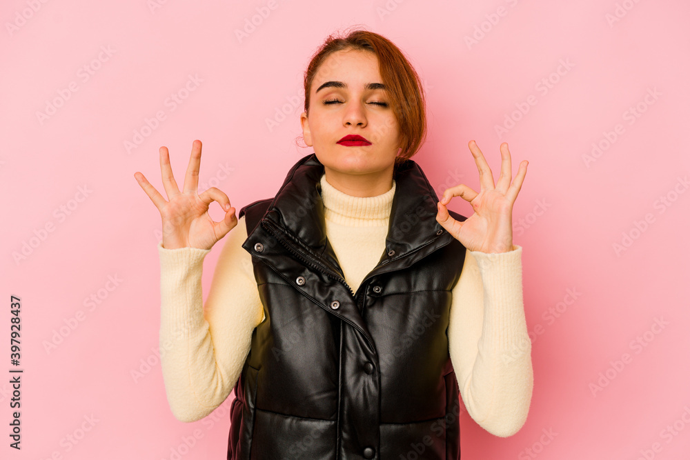 Young arab mixed race woman relaxes after hard working day, she is performing yoga. Young arab mixed race woman relaxes after hard working day, she is performing yoga.