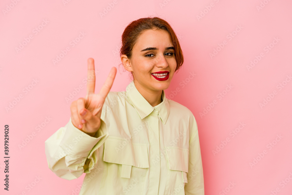Young arab mixed race woman showing number two with fingers. Young arab mixed race woman showing number two with fingers.