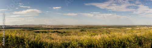 Panorama shot of wrinkled landscape in Badlands national park after sunrise in america