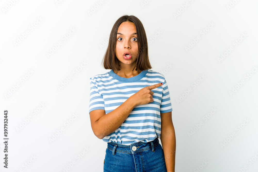 Young mixed race woman pointing to the side Young mixed race woman pointing to the side