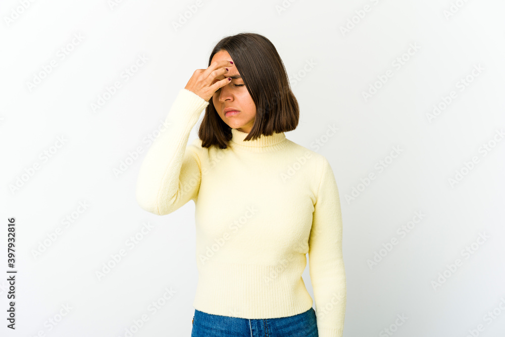 Young mixed race woman having a head ache, touching front of the face. Young mixed race woman having a head ache, touching front of the face.