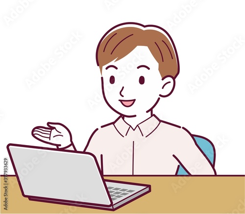 A man in a pink shirt using a computer