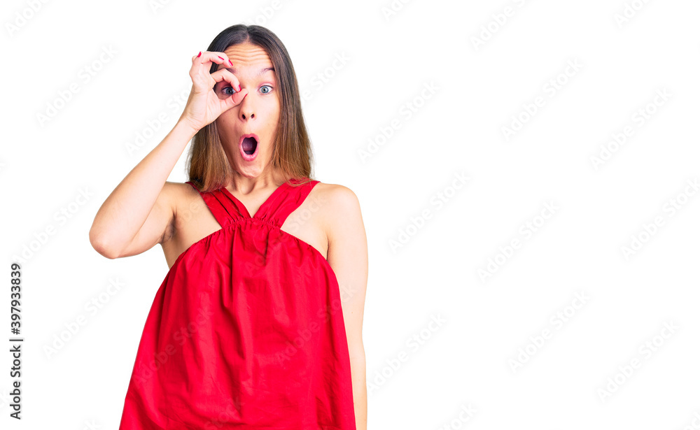 Beautiful brunette young woman wearing casual clothes doing ok gesture shocked with surprised face, eye looking through fingers. unbelieving expression. Beautiful brunette young woman wearing casual clothes doing ok gesture shocked with surprised face, eye looking through fingers. unbelieving expression.