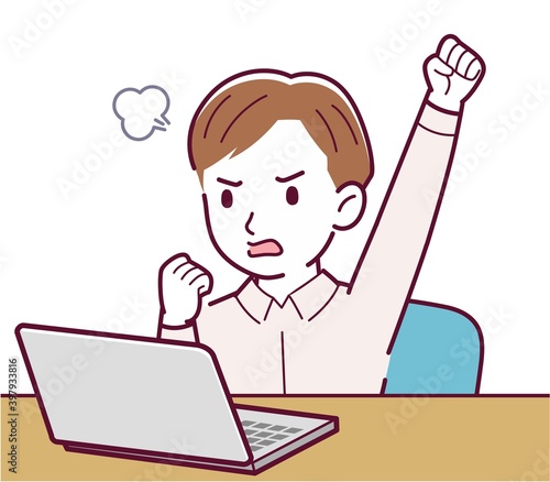 A man in a pink shirt using a computer